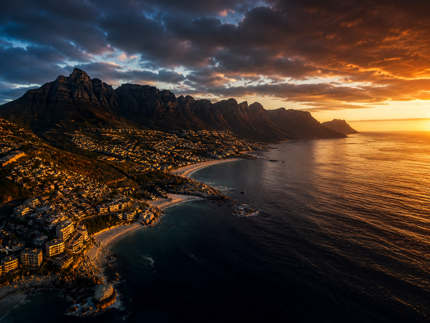 A private candlelit suite overlooking Table Mountain at twilight